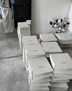 a stack of white boxes sitting on top of a table