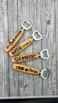 three bottle openers with the words beer time on them