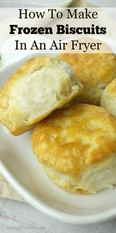 biscuits on a plate with text overlay how to make frozen biscuits in an air fryer