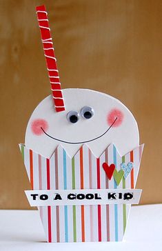 a card made to look like a cupcake with a straw sticking out of it