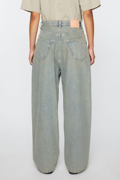 <div>2023 jeans are cut to a super baggy fit with a mid waist, super wide leg and long length. Crafted from non stretch denim in a blue beige wash with a sandy mineral tint.</div> Oversized Straight Leg Faded Bottoms, Faded Oversized Straight Leg Bottoms, Beige Wide Leg Denim Jeans, Oversized Wide Leg Washed Bottoms, Oversized Wide Leg Bottoms, Beige Wide Leg Denim Bottoms, Oversized Light Wash Wide Leg Bottoms, Oversized Wide Leg Jeans With Five Pockets, Oversized Wide Leg Washed Pants