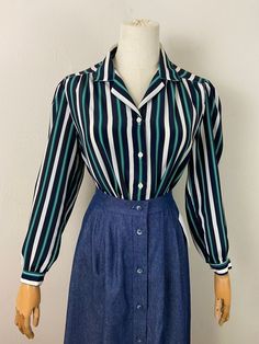 Perfect for warm days!! Fresh and chic!! Beautiful condition and colors. The colors are Kelly green, navy dark blue, soft gold stripe and of white.  Dropped shoulder and Chinese cuff. 38" chest  14" shoulder to shoulder  29" length  18" pit Navy Retro Long Sleeve Top, Navy Long Sleeve Retro Tops, Retro Long Sleeve Navy Top, Vintage Navy Long Sleeve Tops, Retro Blue Blouse For Fall, Blue Retro Blouse For Work, Retro Blue Blouse For Work, Retro Blue Blouse For Workwear, Blouse Elegant