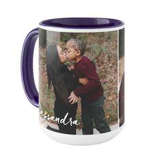 a purple and white coffee mug with an image of a young boy kissing his mother