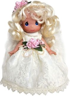 a doll with blonde hair wearing a white dress and pink flower in her hand, on a white background