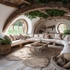 a living room filled with lots of furniture next to an arched window covered in greenery