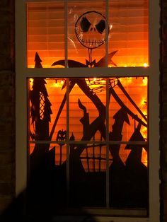 a halloween scene is seen through the window