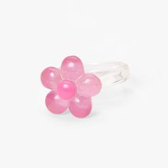 Add this cute and dainty ring to your jewelry collection! Perfect to add a pop of color, this clear resin style ring features a pretty pink flower complete with sparkly glitter. Sizes Available: 7, 8 Finish: Clear Material: Plastic - Claire's Clear Glitter Flower Resin Ring - Pink Spring Pink Flower Ring Gift, Pink Flower-shaped Promise Ring, Adjustable Pink Flower Shaped Rings, Pink Ring For Spring Gift, Pink Ring As Spring Season Gift, Pink Rings Suitable For Spring Gift, Spring Gift Pink Ring, Cute Pink Round Rings, Spring Gift Pink Rings