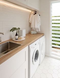 a washer and dryer in a small room