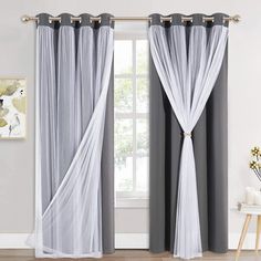 the curtains are open and ready to be hung in front of a window with white drapes