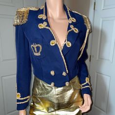 Vintage Victoria Royal Ltd. Military Cropped Beaded Jacket Size 8 Approximately 18 1/2” Armpit To Armpit 18” Shoulder To Shoulder Drycleaned Beading Is In Great Condition Excellent Pre-Owned Condition 4 Snaps Inside, Built In Shoulder Pads Inside Epaulet At End Of Cording Is Slight Fuzzy End, Pic Above It’s Been Like That For Years! Super Unique Piece! Very Hard To Find Blue Embellished Fitted Outerwear, Fitted Blue Embellished Outerwear, Royal Fitted Fall Outerwear, Royal Long Sleeve Outerwear For Fall, Fitted Blue Embroidered Blazer, Blue Embellished Party Outerwear, Blue Embroidered Outerwear For Party, Elegant Embellished Blue Outerwear, Party Embroidered Blue Outerwear