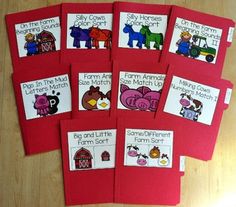 five red folders with farm animals on them and some words in the same language