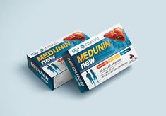 two packets of medunan are sitting side by side on a light blue background