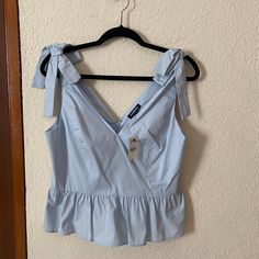 Express Peplum Top Size M V Neck Blouse Bow Detail Chic Blue Tank Top For Spring, Chic Light Blue Tank Top For Spring, Chic Blue Tank Top For Brunch, Light Blue Sleeveless Top For Brunch, Sleeveless Light Blue Tops For Brunch, V Neck Peplum Top, Upcycle Clothes Diy, Upcycled Clothing, Peplum Blouse