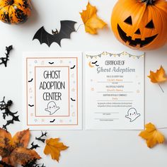 a halloween party with pumpkins, bats and ghost adoption center cards on the table