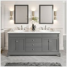 a bathroom vanity with two mirrors above it