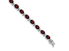 Rhodium over 14k white gold 16 cttw garnet bracelet. Measures approximately 3/16 of an inch in width and has a box catch closure. Classic Silver Bracelet With Birthstone, Classic Silver Birthstone Bracelets, Classic Silver Bracelets With Birthstone, Classic Garnet Jewelry With Polished Finish, Formal Oval Faceted Jewelry, Formal Birthstone Bracelets, Formal Oval Sterling Silver Bracelet With Polished Finish, Classic Faceted Round Bracelets, Fine Jewelry Red Diamond Bracelet For Formal Occasions