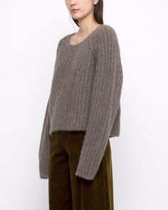 A chunky supersoft and ultra-warm yak-alpaca-extrafine merino wool knit. Features a relaxed and boxy fit, with a cropped silhouette. This sweater perfectly balances out all your high-waisted trousers. + Details Color: Umber 31% Yak, 31% Alpaca, 22% Recycled Nylon, 16% RWS Extrafine Merino Wool XS, S, M, L Julie is 5’9” and wearing a L + Care Hand wash cold, lay flat to dry. Do not tumble dry. Can be dry cleaned. Please note, fine and soft wools can be susceptible to slight pilling. If pilling oc Chunky Cropped Sweater, Sweater Shaver, Trousers Details, Knitwear Dress, Wool Knit, Soft Yarn, High Waisted Trousers, Cropped Sweater, Online Purchase