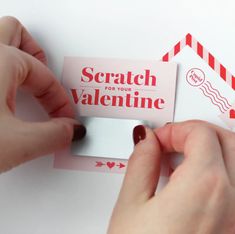 someone cutting out a valentine's day card from a piece of paper that says scratch for your valentine