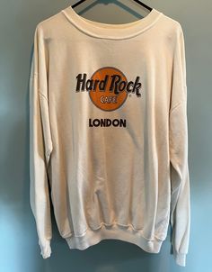 90s Hard Rock Cafe London sweatshirt. Marked a size XL, but fits closer to a today's large. Hard Rock tag, polyester/cotton blend. Large print on the front and blank on the back. Small mark on the back of the sweatshirt as pictured. Could come out with an oxi bath, I haven't tried! Vintage Hard Rock Cafe Sweatshirt, Retro Graphic Print Sweatshirt For Concerts, Grunge Letter Print Sweatshirt For Concert, Retro Crew Neck Sweatshirt For Concerts, Oversized Casual Sweatshirt For Concerts, Grunge Crew Neck Sweatshirt For Concert, Grunge Cotton Sweatshirt For Concerts, Casual Letter Print Sweatshirt For Concert, Relaxed Fit Long Sleeve Sweatshirt For Concerts