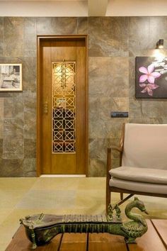 a living room filled with furniture next to a wooden door