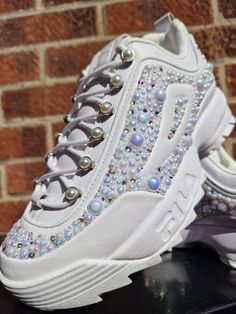 One of a kind Fila Pearl Disrupter trainers/sneakers UK size 7, customised by hand with hundreds of iridescent pearls and swarovski crystals to really give a one of a kind cinderella feel! These would be great for Bride to be, hen party, festival, party or just popping to the shops. Stay sparkley Aimee xx Streetwear Sneakers With Rhinestones And Round Toe, High-top Bling Sneakers For Streetwear, Embellished Lace-up Sneakers For Streetwear, Sporty Low-top Bling Sneakers, Bling Sneakers With Round Toe For Streetwear, Sporty Bling Sneakers For Streetwear, Sporty Streetwear Sneakers With Bling, White Bling Lace-up Sneakers, Crystal Embellished Lace-up Sneakers For Streetwear