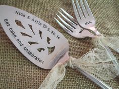 two forks and a fork are sitting next to each other on a cloth covered tablecloth