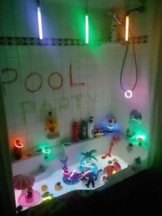 a bathtub filled with lots of toys and lights