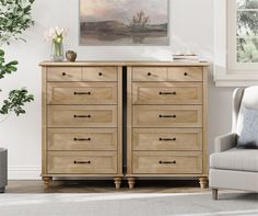 a living room scene with focus on the chest of drawers and a chair in the foreground