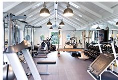 an indoor gym with treadmills and exercise equipment