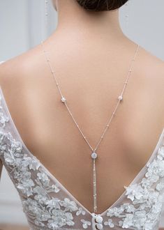 Bridal backdrop necklace made of a very fine sterling silver chain with rhinestone crystal balls and a cubic zirconia round stone in setting. This is an over the head necklace without clasp. Can easily be worn as a sautoir after the wedding. To be worn with matching Josephine bracelet and earrings. - Length: It falls in the back at about 28cm from the base of the neck - 925 Sterling Silver chain Made in France - 7 day return or exchange Made to order: Any length possible, No extra cost. Returns accepted ! Please convo. ♥ Josephine collection https://www.etsy.com/fr/shop/Princessed1jour?ref=l2-shopheader-name&search_query=josephine ♥ All bridal backdrop necklaces https://www.etsy.com/fr/shop/Princessed1jour?ref=seller-platform-mcnav&section_id=22993082 ♥ My shop https://www.etsy.com/fr/shop Delicate Diamond Necklace With Adjustable Chain For Wedding, Wedding Lariat Body Chain With Adjustable Chain, Lariat Body Chain With Adjustable Chain For Wedding, Adjustable Lariat Body Chain For Wedding, Delicate Wedding Body Chain With Adjustable Chain, Delicate Adjustable Wedding Body Chain, Dazzling Wedding Jewelry With Adjustable Chain, Dazzling Jewelry With Adjustable Chain For Wedding, Delicate Adjustable Body Chain For Wedding