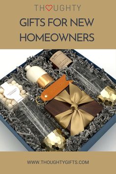 an open gift box filled with gifts for new homeowners