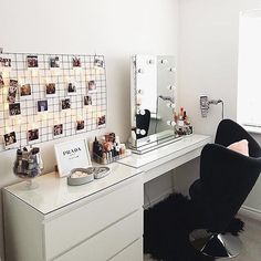 a white desk topped with a chair next to a mirror