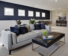 a living room filled with furniture and blue walls