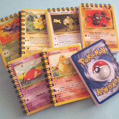 the pokemon notebooks are lined up next to each other