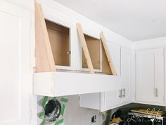 the kitchen cabinets are being built in order to fit into the space above the stove