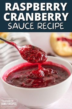 raspberry cranberry sauce recipe in a white bowl with a spoon scooping out