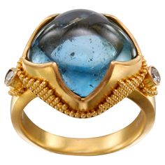 A luscious, bright blue 13 mm cushion shaped aquamarine cabochon is held diagonally in our signature "4 point with jawan" handmade high karat gold design. Stacked geometric "jawan" granulation adorn the sides of the bezels and two 1.8 mm VS1 accent diamonds are set on the sides. The comfortable flat tapered matte-finish shank is currently size 6.5. It is resizable. One of our most popular designs, this rich blue stone and ring is a stunner! You won't be disappointed! 22k Gold Ring, Diamonds Ring, Best Jewelry, Blue Life, Comfortable Flats, Popular Designs, 3 Carat, 22k Gold, Gold Design