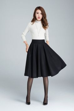 "A circle skirt is a full, swing skirt that gets its name from the circular shape of the skirt when it is spread out. Find your winter skirt in this black knee length skirt from Xiaolizi. The woman skirt made from a soft wool fabrication in a pull-on construction + circle silhouette. DETAIL * 30% wool, 30% fiber, 40% polyester * fully satiny lining, only attached at the waist * Hidden zipper in the back * Two pockets on each side * high waist skirt * knee length * Perfect for autumn, winter * 19 Black Skirt Winter, Skirt Diy, Peplum Tops, Classic Skirts, Rock Outfit, Womens Skirts, Trendy Skirts, Full Circle Skirts, Winter Skirt