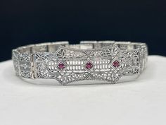 "This is a beautiful \" true to the period\"  Art deco style 925 sterling silver bracelet.  This bracelet features natural Ruby stones 7 inches in length" Period Art, Filigree Bracelet, Ruby Stone, Natural Ruby, Art Deco Style, Deco Style, Chain Link Bracelet, Sterling Silber, Art Deco Fashion