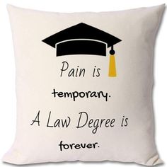 a pillow with a graduation cap on it that says pain is temporary, a law degree is forever