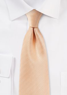 Introducing the Peach Apricot Herringbone Necktie, a true embodiment of timeless elegance and subtle sophistication. This exquisite accessory adds a touch of refinement to any ensemble with its delicate blend of peach and apricot hues, beautifully woven in a classic herringbone pattern. Pair it with a crisp white or light blue dress shirt for a polished and dapper look that seamlessly transitions from the office to a stylish night out. Shopping for men's suits? This necktie effortlessly compleme Elegant White Ties For Work, Elegant White Ties For Workwear, Elegant Beige Suit And Tie Accessories For Wedding, Elegant White Formal Ties, Elegant Beige Wedding Suit And Tie Accessories, Elegant Gold Ties For Business, Elegant Cream Standard Tie, Classic Gold Tie For Formal Occasions, Elegant Beige Tie For Black Tie Events