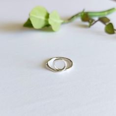 This unique small loop circle ring is handmade with precision and care, and crafted from high-quality sterling silver.  Its simple yet elegant design makes it perfect for everyday wear, adding a touch of sophistication to any outfit. The durable material ensure that this ring will last for years to come, becoming a cherished piece in your jewelry collection.  Whether you're dressing up or keeping it casual, this handmade sterling silver ring is the perfect accessory for any occasion.  *Great for Adjustable Sterling Silver Stackable Rings With Simple Design, Adjustable Simple Sterling Silver Stackable Rings, Minimalist Sterling Silver Stackable Rings For Promise, Adjustable Hoop Rings For Everyday, Minimalist Sterling Silver Promise Ring, Minimalist Sterling Silver Stackable Rings As Gift, Nickel-free Minimalist Stackable Rings For Anniversary, Minimalist Sterling Silver Stackable Rings For Anniversary, Everyday Stackable Rings With A Modern Twist