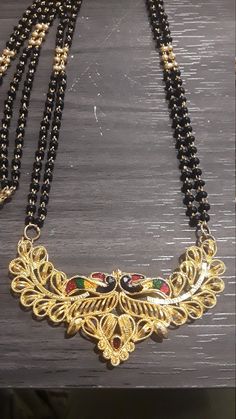 This is a gorgeous vintage black and gold beaded necklace with a wide goldtone filigree metal with 2 Enamel tucan birds and a rhinestone on the bottom of the pendant. The necklace measures 24 inches long and can be put right over the head  The gorgeous pendant measures 3 inches wide. The pendant necklace is in excellent vintage condition. Tucan Birds, Gold Beaded Necklace, Gold Bead Necklace, The Head, Gold Beads, Black And Gold, Vintage Black, Necklace Etsy, Jewelry Necklace Pendant