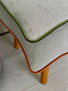 a close up of a chair cushion on the floor