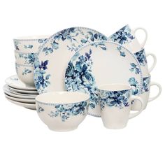 a blue and white dinnerware set with flowers on the front, in various shapes and sizes