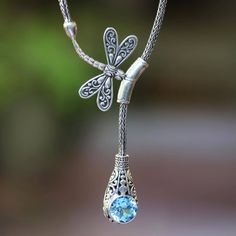 Crafted from sterling silver intricate designs frame a glittering gemstone of faceted blue topaz. Balinese artisan Suar Dwipayana designs this pendant necklace featuring a sterling dragonfly slider that gives it an adjustable length. Blue Topaz Pendant Necklace, Summer Rings, Blue Dragonfly, Dragonfly Jewelry, Blue Topaz Pendant, Topaz Pendant, Topaz Color, Dragonfly Pendant, Sterling Silver Dangle Earrings