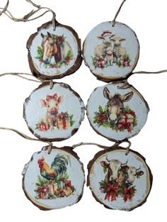 four christmas ornaments with animals on them