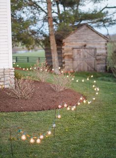 some lights that are sitting in the grass