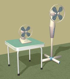 a small table with a fan on it next to a smaller table that has a laptop