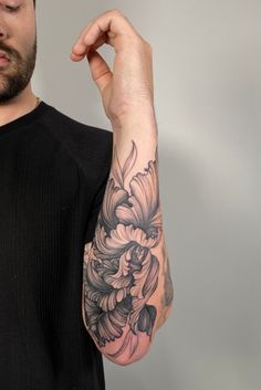 Shows an arm with fresh black linework tattoo of iris flowers. With black line details and shading. Mens Floral Forearm Tattoo, Masculine Floral Tattoo, Floral Tattoo For Men, Botanical Forearm Tattoo, Mens Flower Sleeve Tattoo, Hyper Realism Tattoo, Mandala Tattoo Elbow, Japanese Floral Tattoo, Flower Tattoo Men